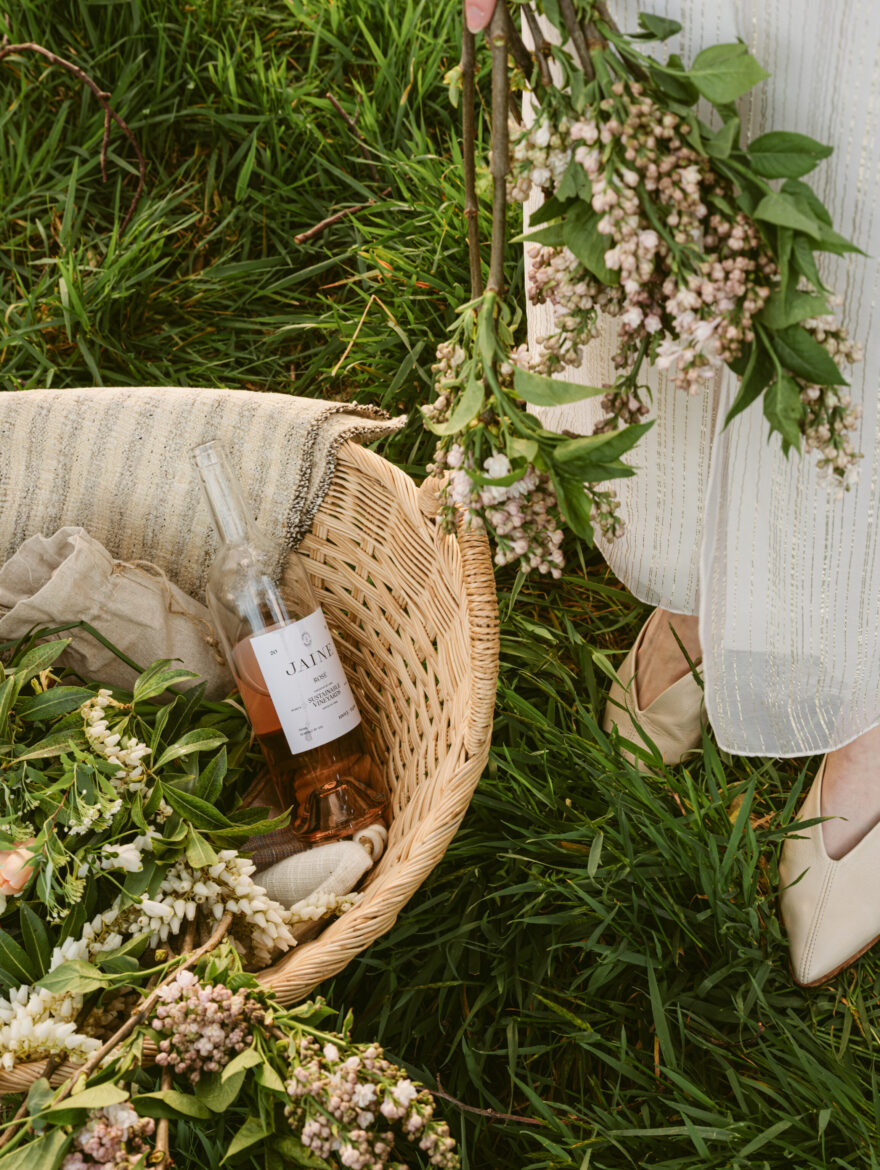 Jaine wine with flowers in basket